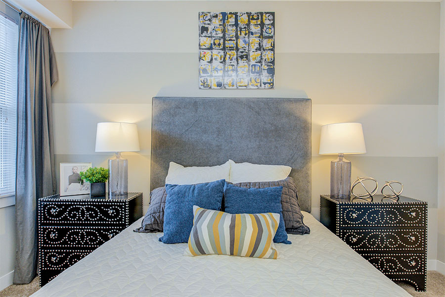 Gray and blue bedroom at Highpointe Apartments.