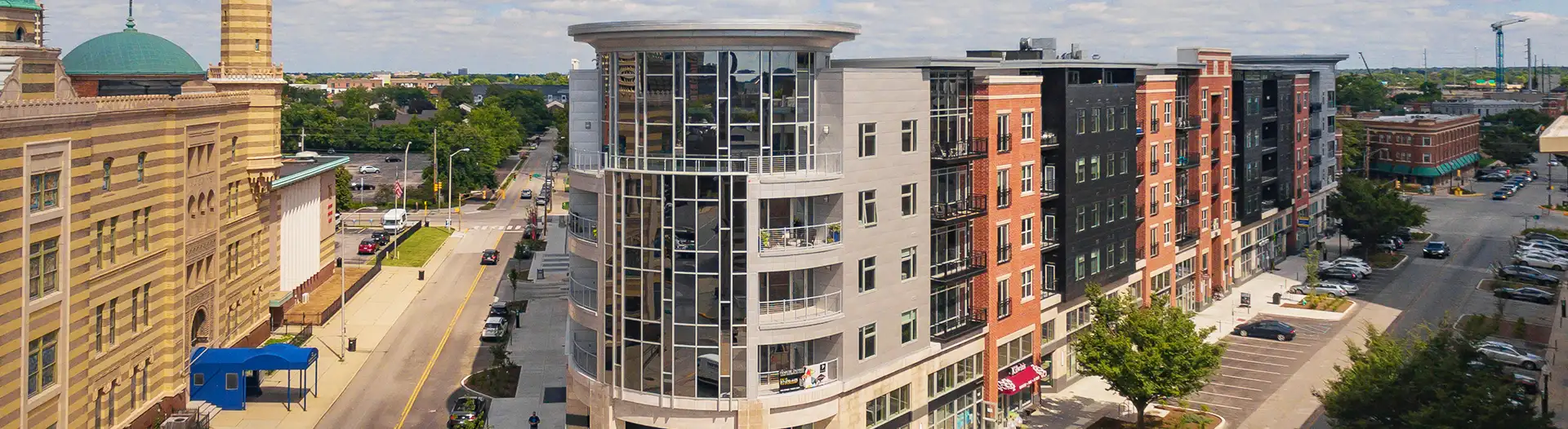 Aerial wide view of the exterior of Penrose On Mass Apartments